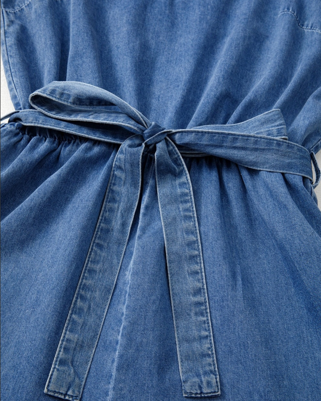 Chambray Spaghetti Strap Romper with Ruffle Hem and Belted Waist